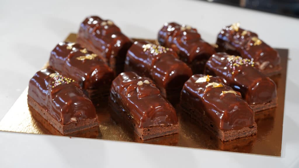 mini yule log glazed with chocolate mirror glaze