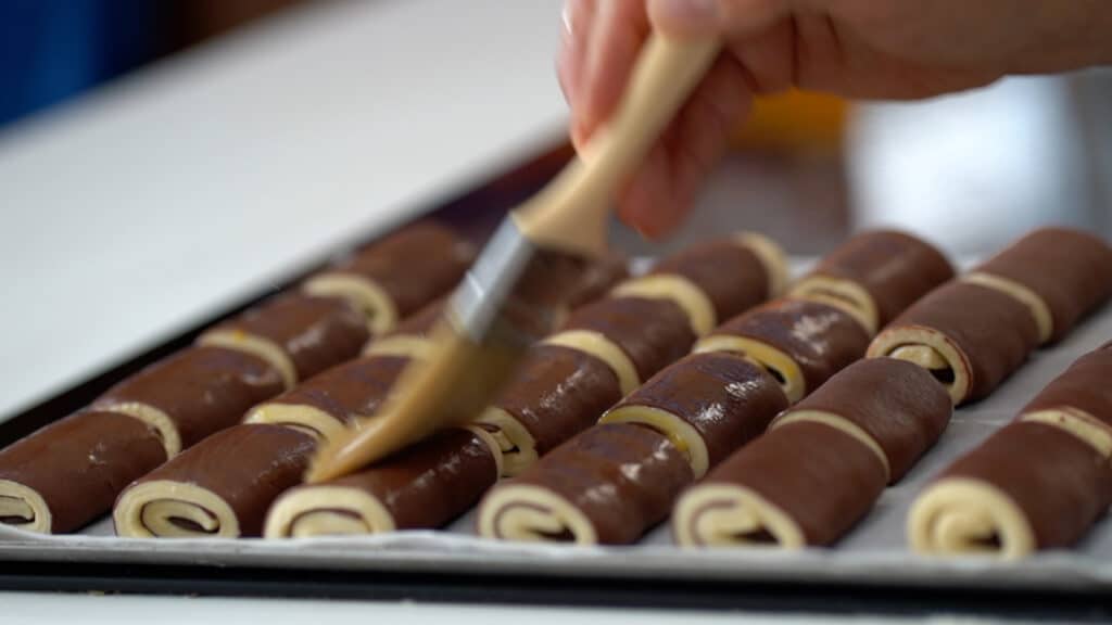 egg washing chocolate croissant