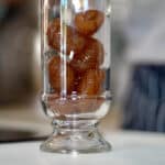 filling jar with marrons au sirop