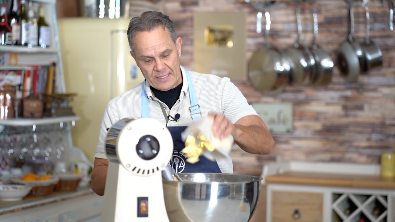 adding butter to the first panettone dough