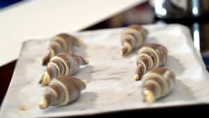6 frozen bicolor croissants on baking tray