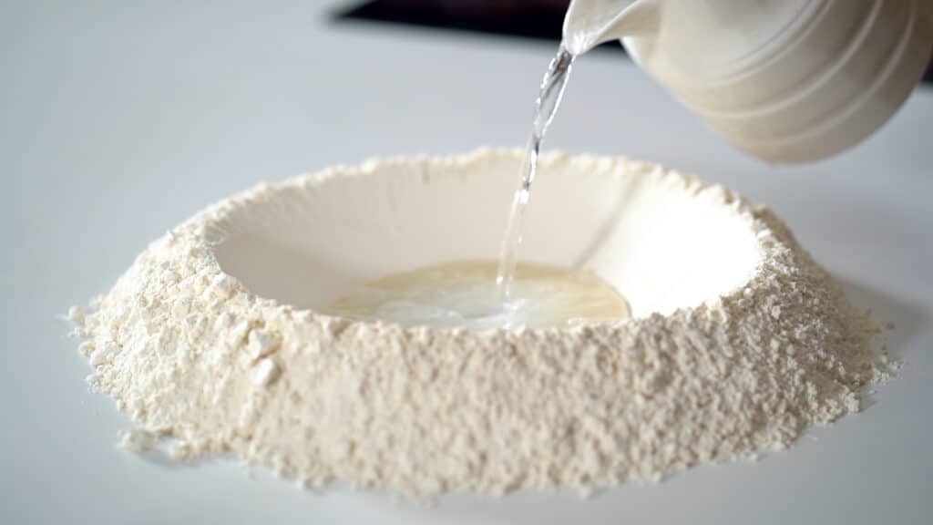 kneading pizza dough