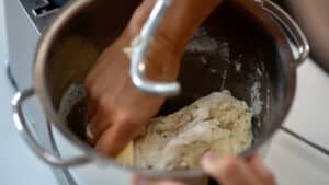 scraping mixing bowl croissant dough