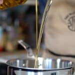 pouring oils in pan