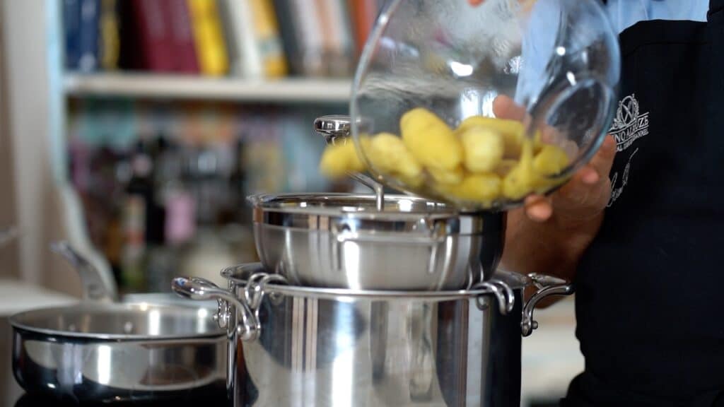 passing potatoes through food mill