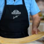 rolling pasta dough in pasta maker
