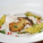 plated coconut steamed hake fish