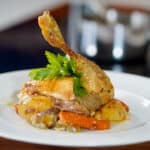 plated roasted chicken with veggies