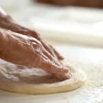 shaping pizza into round