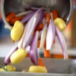 throwing veggies in pan