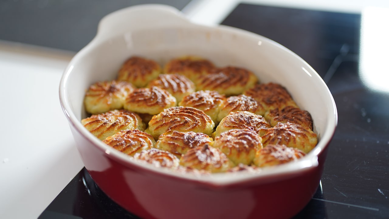 twice baked potatoes in shallow dish